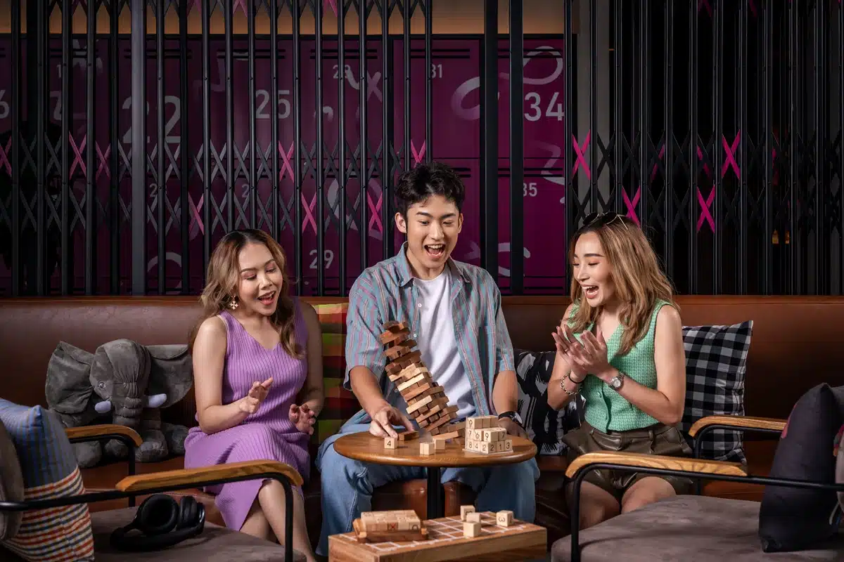 Moxy Bangkok Ratchaprasong Turns Up the Play This September with Rooftop Flavours, Daily Beats and Last-Chance Bonus Points 2 L Guests enjoy games at the lounge area of Moxy Bangkok Ratchaprasong